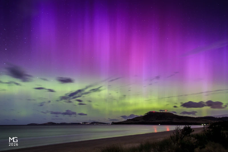 Glowing Sky Aurora Australis lights up the night sky over the South Arm, as viewed from Seven Mile Beach. The night of my arrival at Hobart heralded one of the most intense auroral events of the year.