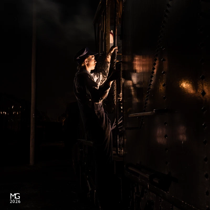 Night shift Evoking scenes from the 1940s, our patient model Matt poses in the cab door of K163 during a night photo shoot at Newport Workshops during the biennial Open Days weekend. K163 is visiting Newport for some essential maintenance, making good use of the skills and resources available at this historic site.