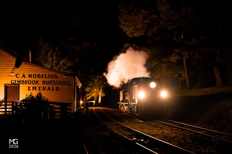 Packing Shed nights For the duration of the winter school holidays, Puffing Billy Railway are running the "Train of Lights" specials from Lakeside to Gembrook and return.As there are no locomotive stabling and servicing facilities at Lakeside, NG/G16 129 - the specially-equipped steam loco that hauls the popular train - must depart from Belgrave earlier in the day before heading over to Lakeside and pick up the carriages. Once the train returns to Lakeside and the passengers have all departed for home, the NGG must return to Belgrave where the crew will clean out the ash, fill the water tanks, and ready it for the following evening's service. This photo is the result of careful planning, lots of trial and error over a couple of nights on location, and the end result has been lit with four off-camera flashes triggered wirelessly using Canon's radio controller system.