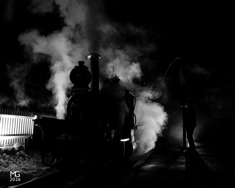 Night at Lakeside After dropping off passengers at Nobelius Siding - aka, The Packing Shed - for their sit-down dinner in the heritage fruit packing building, 12A takes water at Lakeside station on a cold and still spring evening in 2018.