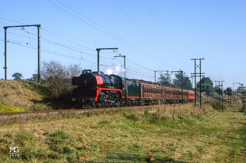 Slide 18 R707 coasts into Warragul with the ARHS "Coalie" tour to Traralgon. After a spin on the turntable at Traralgon, the train made a brief stop at Morwell to pick up a rake of seven GY wagons loaded with coal briquettes: at Dandenong the GYs were shunted into a siding, the briquettes destined for the furnaces at the nearby Heinz factory. The briquette trains stopped in 1996, and after a fire in 2003 the factory limped along at reduced capacity until finally closing in 2014. Beyond the fact that this was likely the last genuine mixed train to operate in Victoria, the other point of significance is this photo is from the first roll of film I'd shot, at just 5 years old.