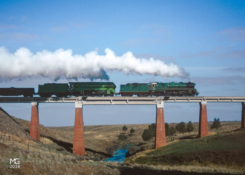 Mount Emu Creek During a photo stop on their way to Ararat, 3830 and 3801 tear across the bridge over Mount Emu Creek under perfect lighting. Stretching for over 250km Mount Emu Creek is Victoria's longest creek, starting near Trawalla and emptying out to sea via the Hopkins River.