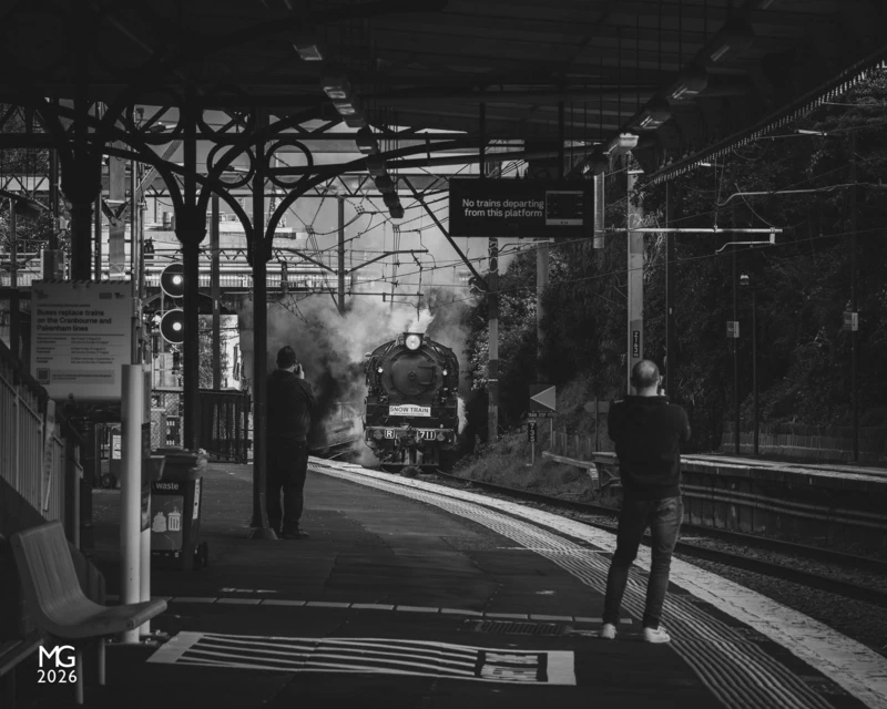 Monochromatic morning Enthusiasts watch on as R711 and R761 erupt below Cromwell Road overpass on the outskirts of Hawksburn station with the 2023 Snow Train.