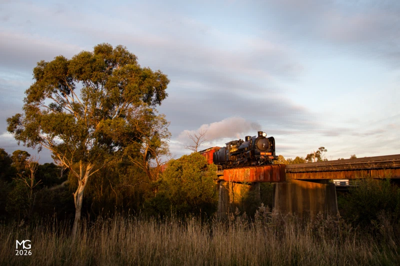 Back in action Returning from Traralgon after a successful relauch trip, A2 986 storms across the Bunyip River bridge between Longwarry and Bunyip and catches the last rays of sunlight.