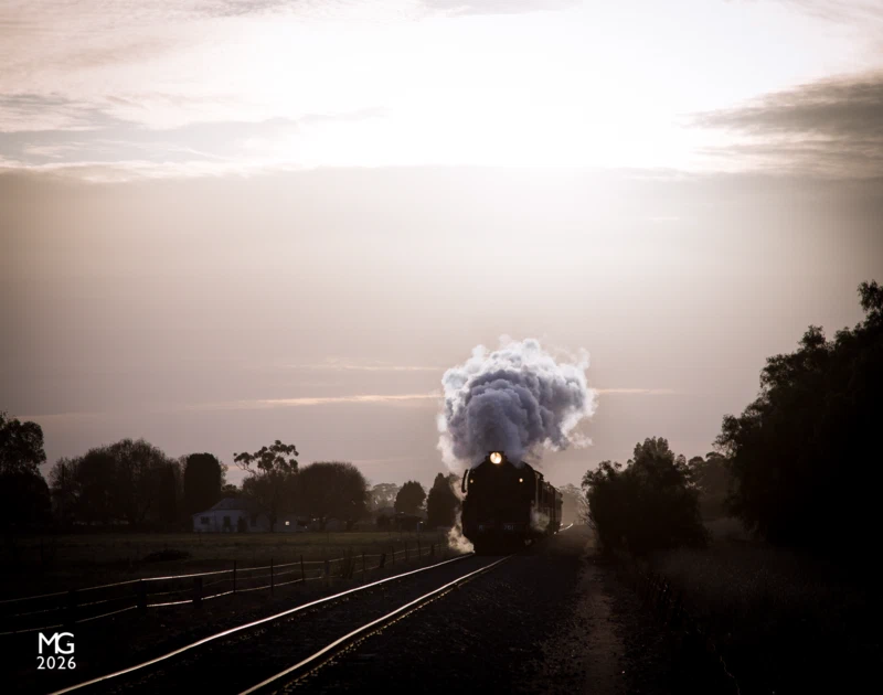 Split the silence As the sun sets in the sky behind, casting glorious golden tones across the landscape, R761 roars towards Kyabram with Steamrail's Echuca Explorer tour train.