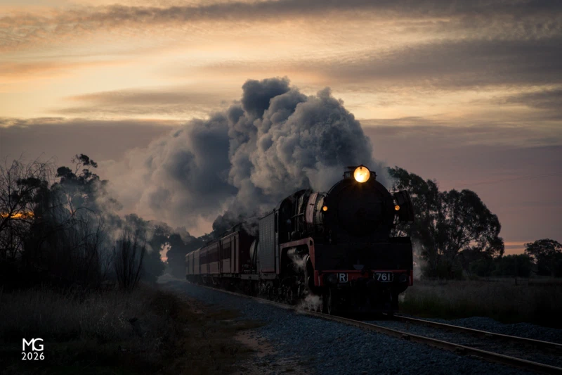 Inexorbalis Just off the Midland Highway, near Tatura, R761 races to escape the setting sun as it drives relentlessly onwards to Melbourne with the return of Steamrail's Echuca Explorer tour train.