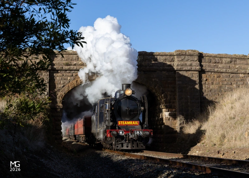 Bluestone It's a mild autumn morning at Navigators as K183 erupts from underneath the bluestone road bridge. K183 and A2 986 were sequestered to Ballarat for the annual heritage weekend, providing shuttle trains from Ballarat to Yendon and return.