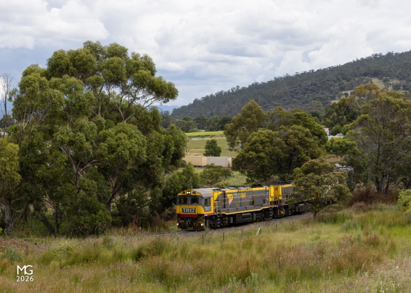 Camel Two of Tasrail's ubiquitous TR class locos - TR17 and TR15 - sweep around the marshy flats of Dromedary as they work down the River Derwent from Boyer. The two locomotives and their train of containers would spend the rest of the day travelling northwards, arriving in the Bass Coast town of Burnie in the early hours of the following day.