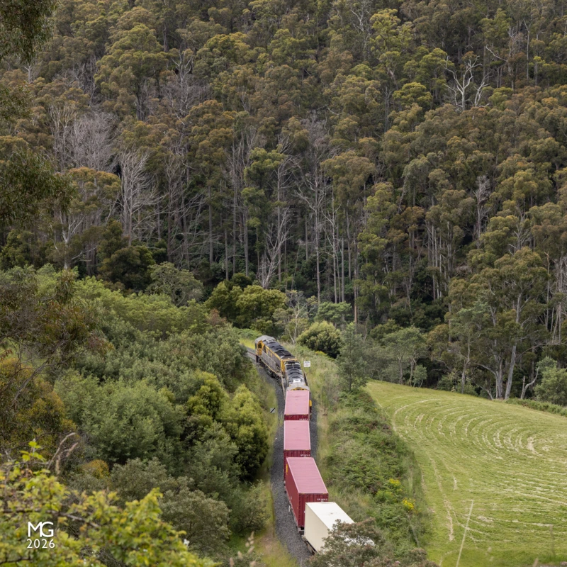 Terrain TR11 and TR13 hug the hillside along Coal River as they work uphill from Colebrook towards Rhyndaston. The steep hills and twisting rail corridor are typical of most of the Tasmanian railway network, highlighting the challenges faced by Tasrail when competing for traffic against the modern highway network.